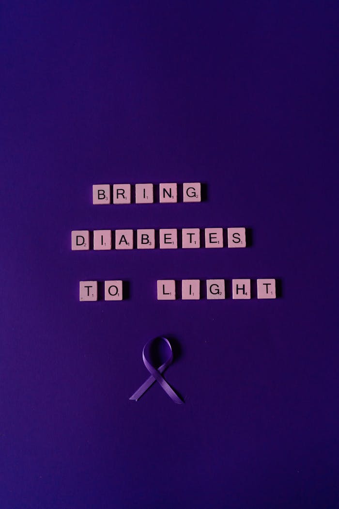 services-01 Scrabble tiles arranged to raise diabetes awareness on a purple background.
